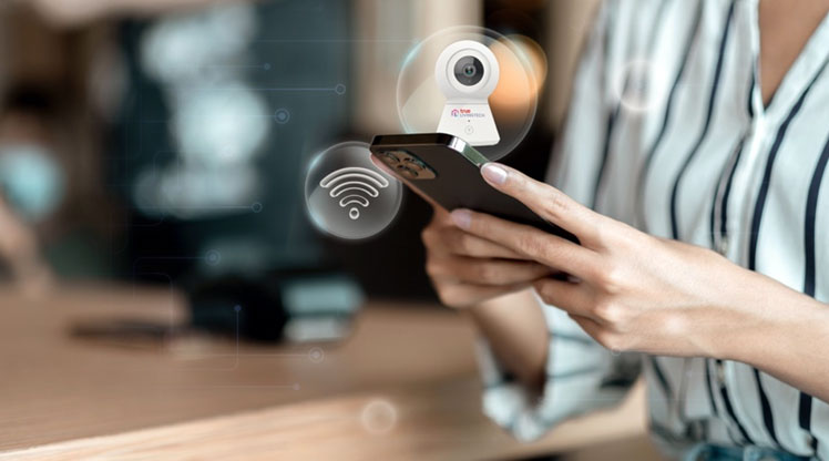 A person holding a phone  Description automatically generated with low confidence