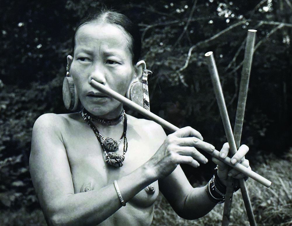 Penang Woman Playing Nose Flute