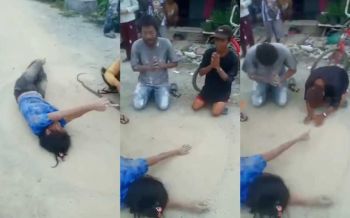 สุดแปลก! เมียคนงานพม่าเลื้อยไปมาบนถนน ผัวตัดหัวงูโร่จุดธูปขอขมา (คลิป)