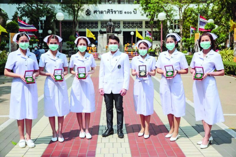 เหรียญที่ระลึกในหลวงรัชกาลที่ ๙  เพื่ออาคารนวมินทรบพิตร ๘๔ พรรษา